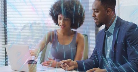 Professionals Collaborating in Modern Office with Data Visualization Overlays