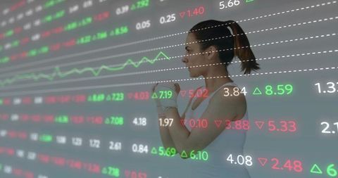 Female athlete fastening hand wraps with stock market data overlay for fitness tech