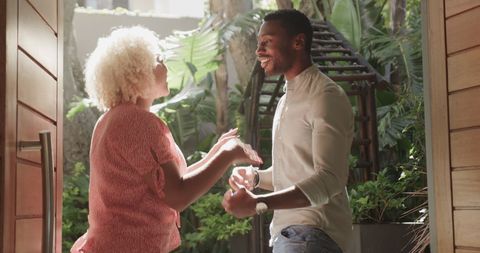 Couple Embracing Happy Moment in Sunny Garden Setting