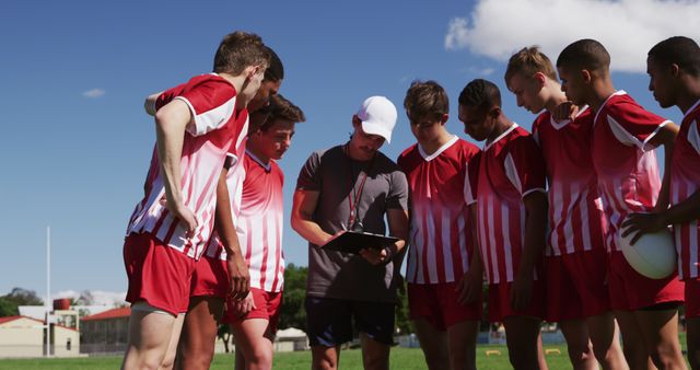 Soccer Coach Discussing Strategy with Junior Players on Field - Download Free Stock Images Pikwizard.com