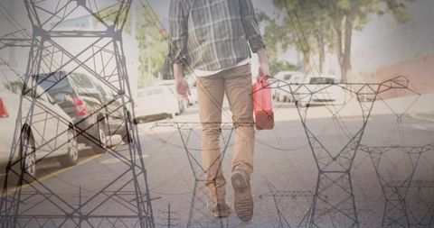 Man walking with canister overlaid with electricity poles
