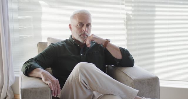 Stylish Mature Man Relaxing in Modern Living Room - Download Free Stock Images Pikwizard.com