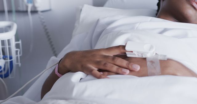 Patient Resting in Hospital Bed with IV and Medical Monitor - Download Free Stock Images Pikwizard.com