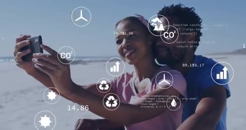 Couple Enjoying Beach with Environmental Technology Interface