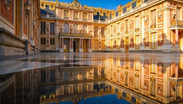 Sunlit baroque palace courtyard reflecting in shallow mirror water, ornate gilded facade