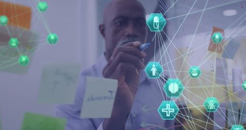 Businessman developing digital network interface in office