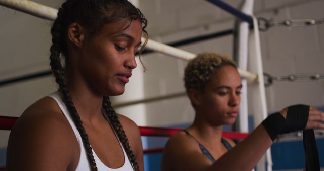 Female Boxers Wrapping Hands Before Training in Gym - Download Free Stock Images Pikwizard.com