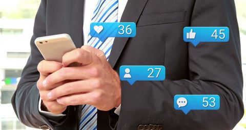 Businessman Managing Social Media Engagement on Smartphone