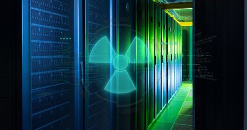 Nuclear symbol over digital software on data servers illustrating security risks
