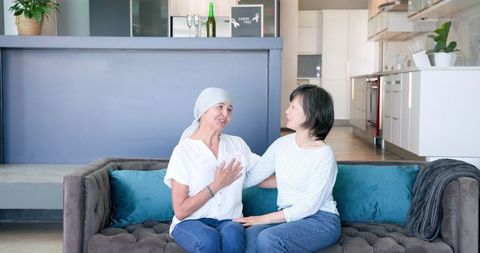 Senior Friends Embracing Moments of Friendship at Home