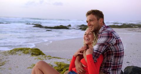 Happy Couple Embracing on Serene Beach - Download Free Stock Images Pikwizard.com
