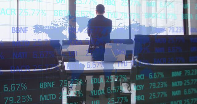 Businessman Analyzing Global Stock Market Trends in Modern Office - Download Free Stock Images Pikwizard.com