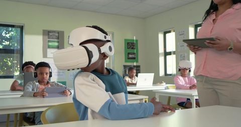 African American Students Using VR Headsets and Tablets for Immersive Classroom Learning