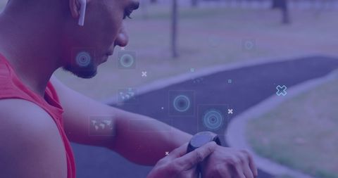 Man Monitoring Fitness Tracker During Outdoor Workout