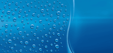 Water drops on transparent glass surfaces with light reflections