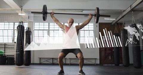 Athlete Lifting Overhead Barbell with Fitness Analytics Overlay in Industrial Gym
