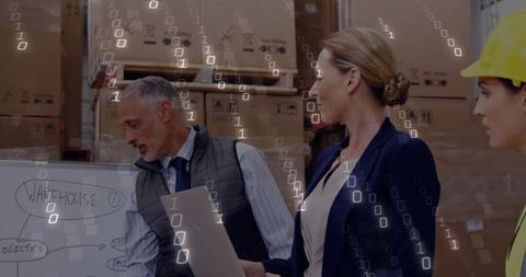 Warehouse managers reviewing logistics plans beside pallet stacks with data overlay