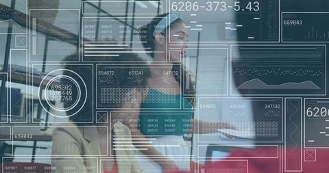Woman leading team meeting with interactive data dashboard overlay in modern office