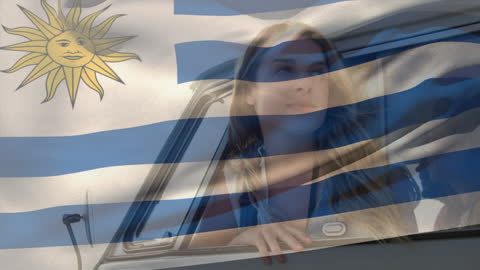 Woman Enjoying Breeze Overlaid on Waving Flag of Uruguay