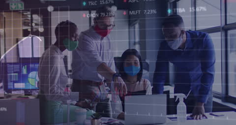 Business Team Analyzing Financial Data Wearing Masks for Safety