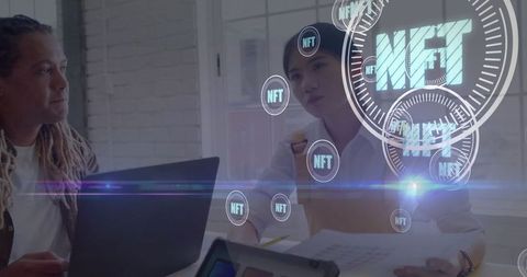 Colleagues discussing nft strategy in modern office