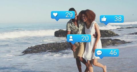 Couple Walking by Ocean with Social Media Interaction Icons