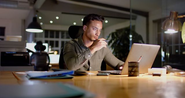 Focused Businessman Working Late at Night in Office - Download Free Stock Images Pikwizard.com