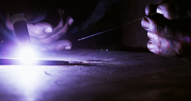 Close-up of Hands Welding Metal in Dark Workshop - Download Free Stock Images Pikwizard.com