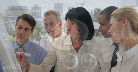 Diverse business team brainstorming with data graphics overlay