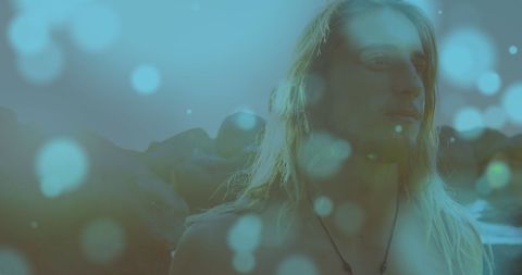 Thoughtful Young Man with Long Blonde Hair Against Mountains - Download Free Stock Images Pikwizard.com