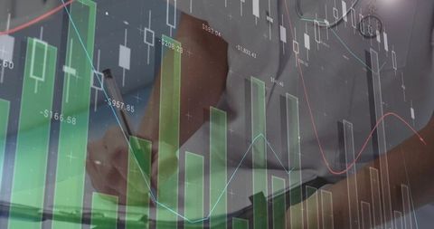 Businesswoman writing while reviewing financial charts and analytics with data overlay
