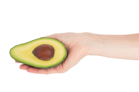 hand holding fresh avocado half on transparent background - Download Free Stock Videos Pikwizard.com