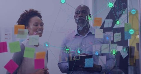 Collaborating and brainstorming with sticky notes, tablet and network visualization on glass