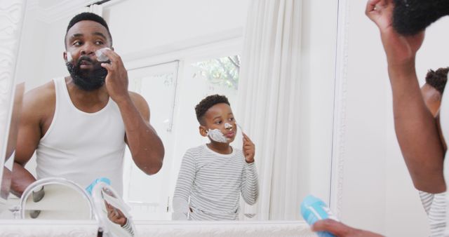 Father and Son Shaving Together in Front of Mirror - Download Free Stock Images Pikwizard.com