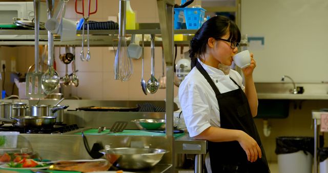 Chef Drinking Coffee in Restaurant Kitchen During Break - Download Free Stock Images Pikwizard.com