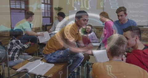 Teen leading classroom collaboration sharing notes and exploring digital technology