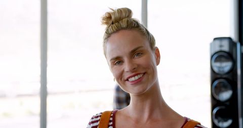 Businesswoman smiling in bright office environment