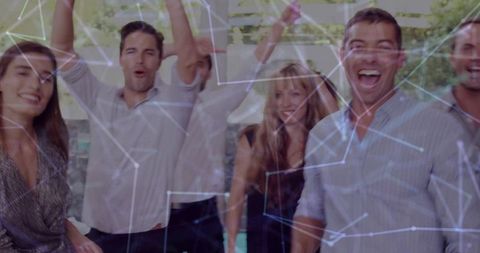 Excited Colleagues Celebrating Success with Digital Network Overlay