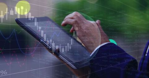 Businesswoman using tablet for trading and market analysis with overlaid stock charts