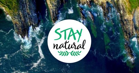 Stay Natural Text Over Majestic Coastal Rocks and Waves