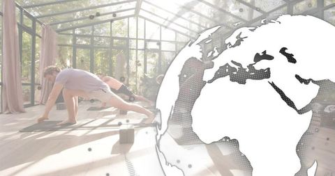 Sunlit greenhouse yoga class practicing deep lunges group fitness and mindfulness