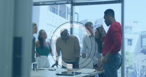 Diverse Team Analyzing Data with Futuristic Interface in Modern Office