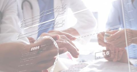 Doctor examining patient wrist with digital health overlays and collaborative clinical data