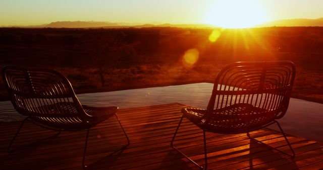 Two Empty Chairs on Patio During Sunset Over Mountainous Horizon - Download Free Stock Images Pikwizard.com