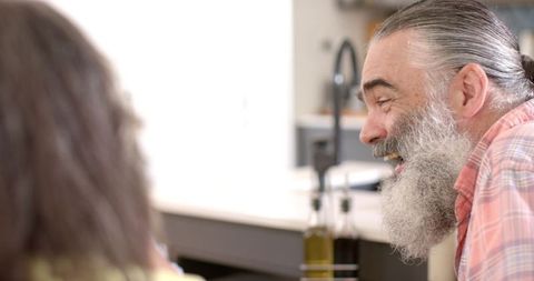 Senior Friends Sharing Joyful Moment in Kitchen Setting