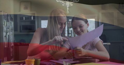 Mother and daughter bonding through creative paper crafting