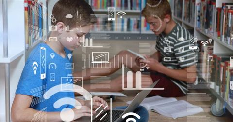 Schoolboys Using Tablet and Laptop in Library with Digital Interface - Download Free Stock Images Pikwizard.com