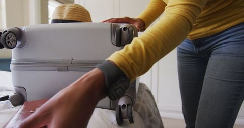 Woman Packing Suitcase for Safe Holiday Travel Amidst Pandemic - Download Free Stock Images Pikwizard.com