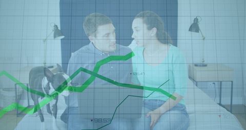 Couple Analyzing Finances with Digital Data Overlay at Home