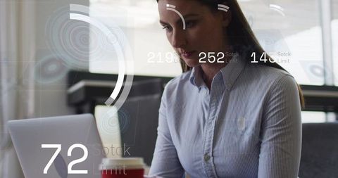 Businesswoman typing on laptop with futuristic hud overlays showing data analytics and productivity